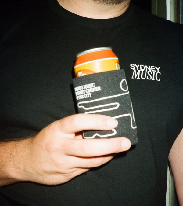 SydneyMusic.net new merch featuring a logo t-shirt and stubby cooler